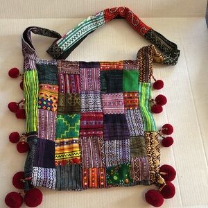 PATCHWORK BOHO SLING STYLE CROSSBODY COLORED PATCHES WITH RED BALL TASSELS
